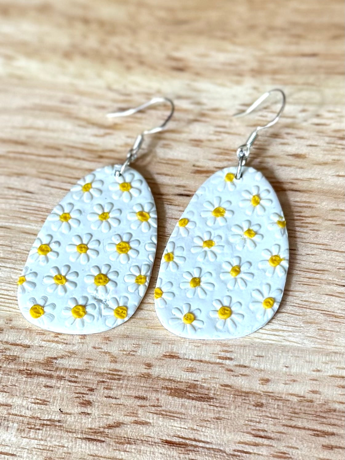 White oval daisy yellow polka dot dangle earrings